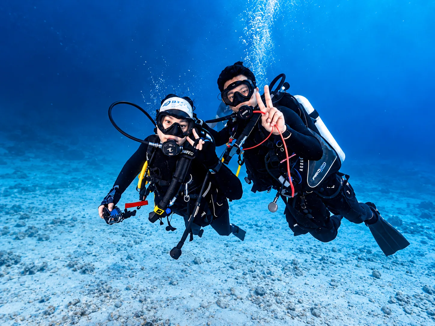 Two scuba divers underwater in Thailand